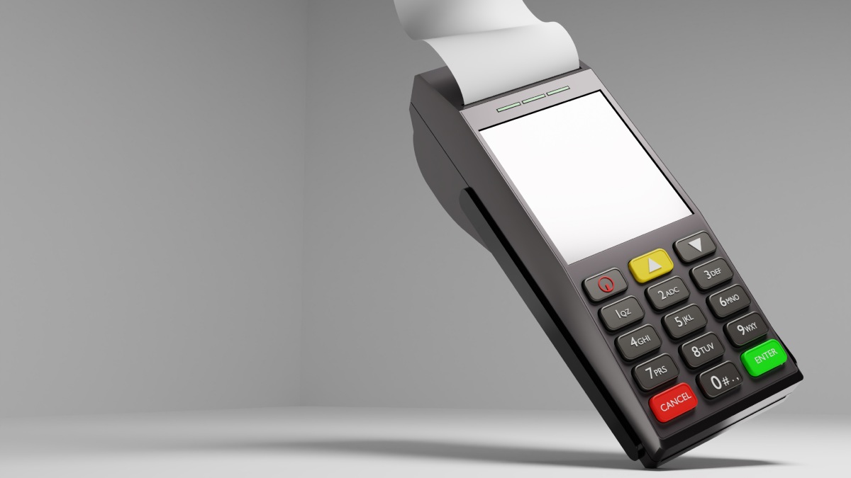 Terminal de paiement. le terminal bancaire flotte dans l'air. Machine pour accepter les cartes bancaires. dispositif permettant de retirer de l'argent de la carte bancaire.
